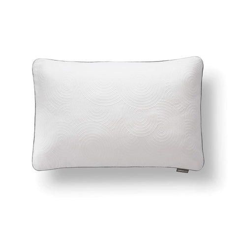 White pillow protector with waterproof barrier guarding against moisture