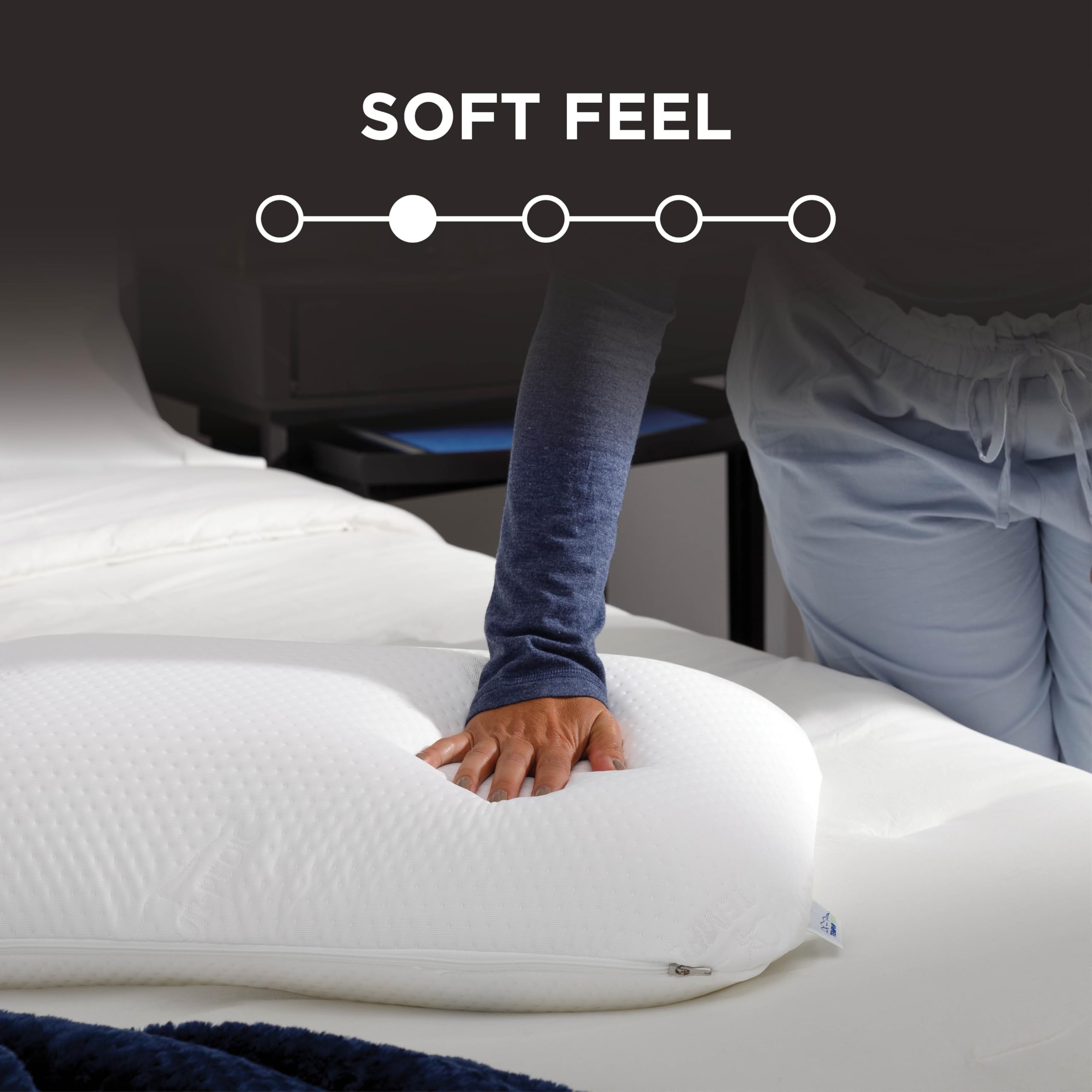 TEMPUR-Symphony Pillow on a bed scene in a cozy sleep setup.