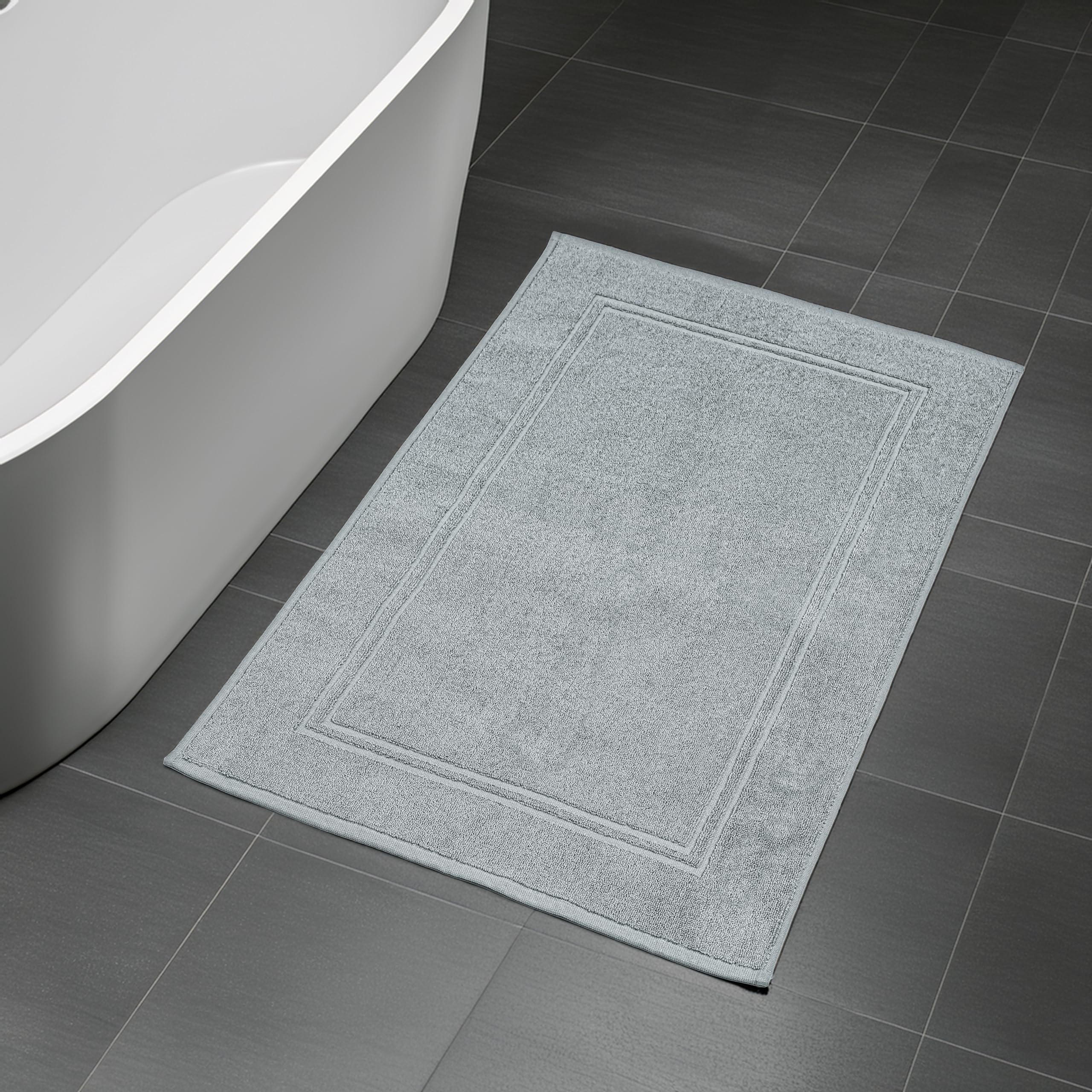 20 by 32 inches Tens Towels mat shown covering ample bathroom floor area.
