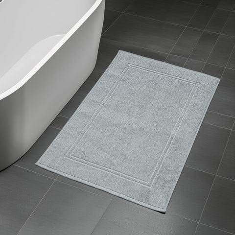 20 by 32 inches Tens Towels mat shown covering ample bathroom floor area.
