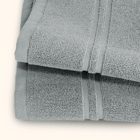 Care-ready Tens Towels bath mat drying after washing for quick reuse.