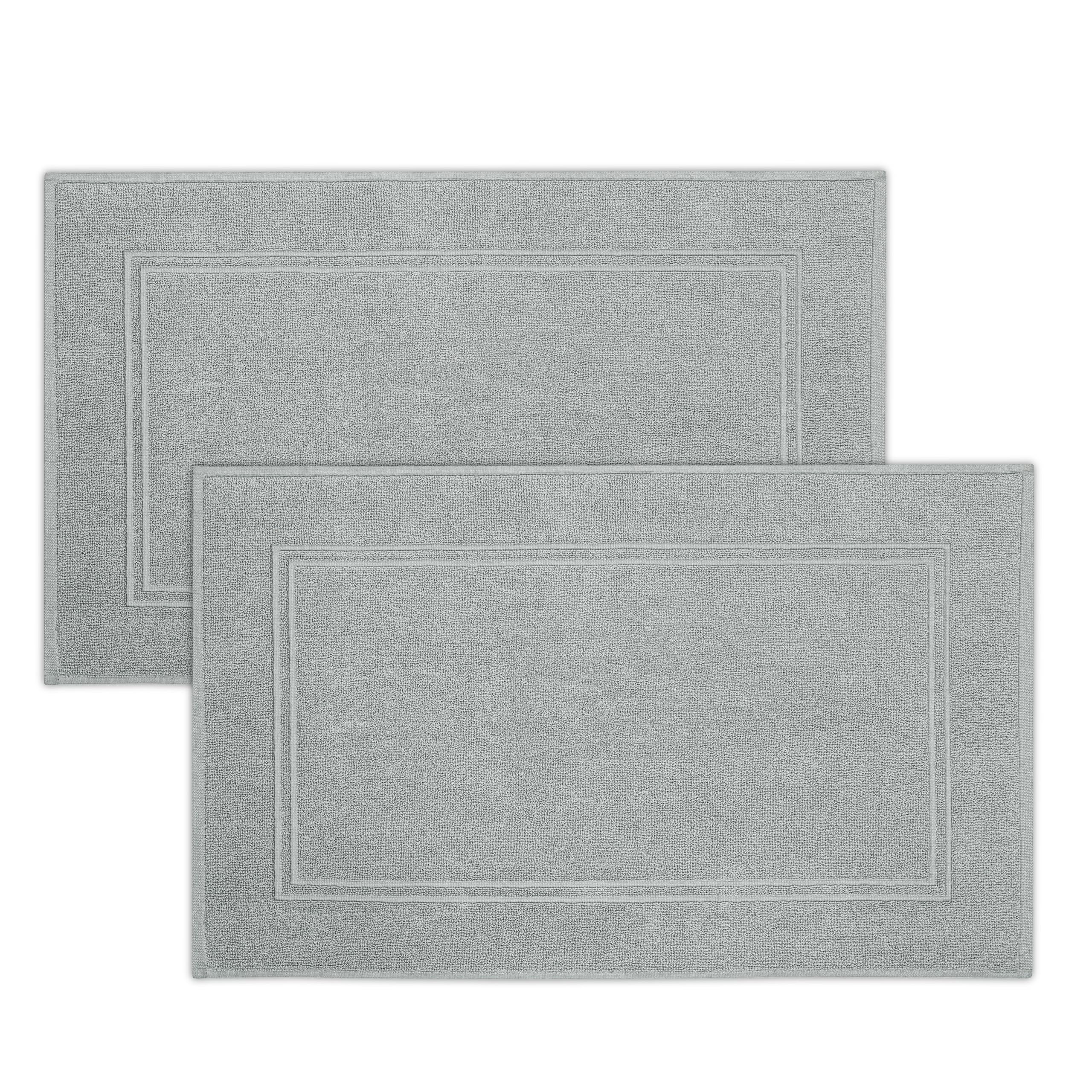 Tens Towels bath mat close-up shows plush terry softness for cozy feet.
