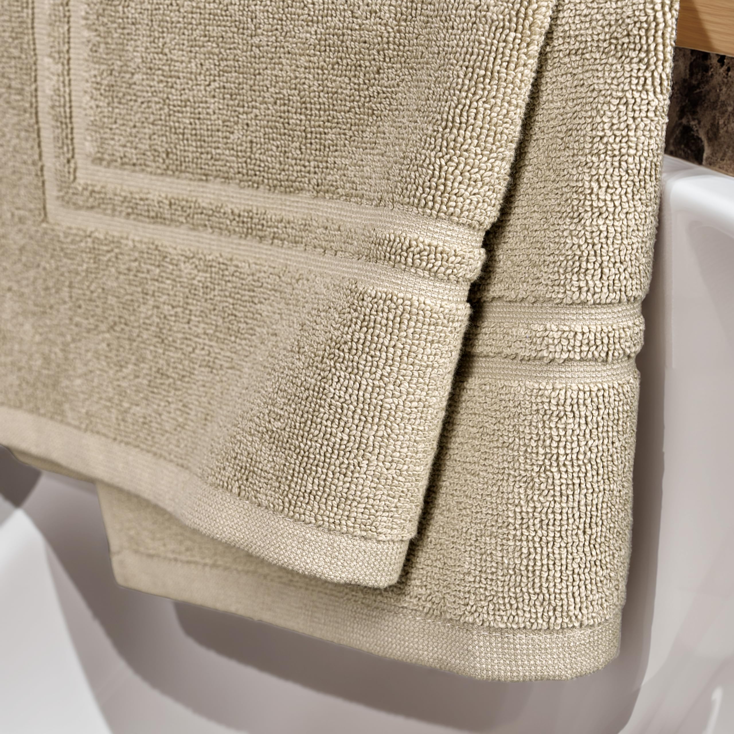 Tens Towels bath mats showing high absorbency after a shower