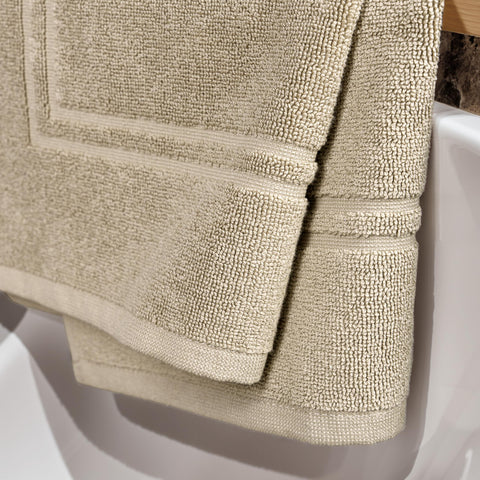 Tens Towels bath mats showing high absorbency after a shower
