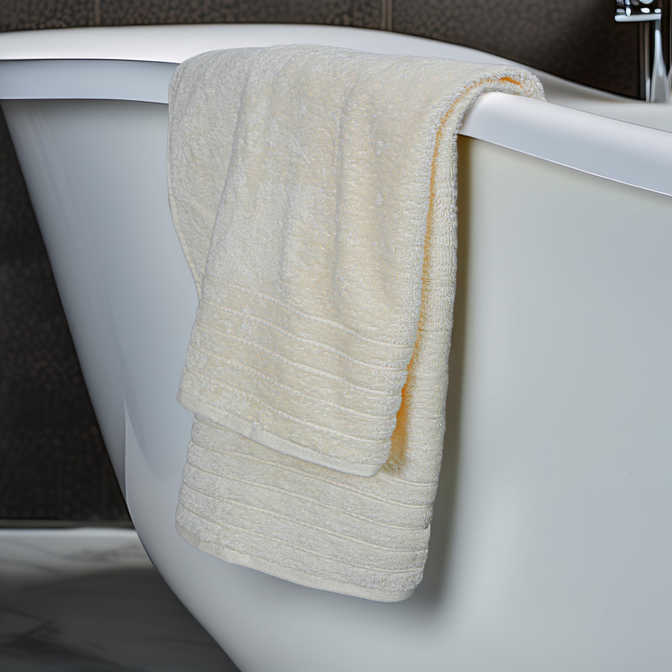 Tens Towels bath sheet cream draped on bed highlights luxurious size