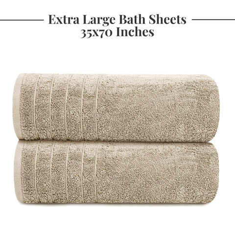 Tens Towels oversized beige bath sheet shown wrapped for use.