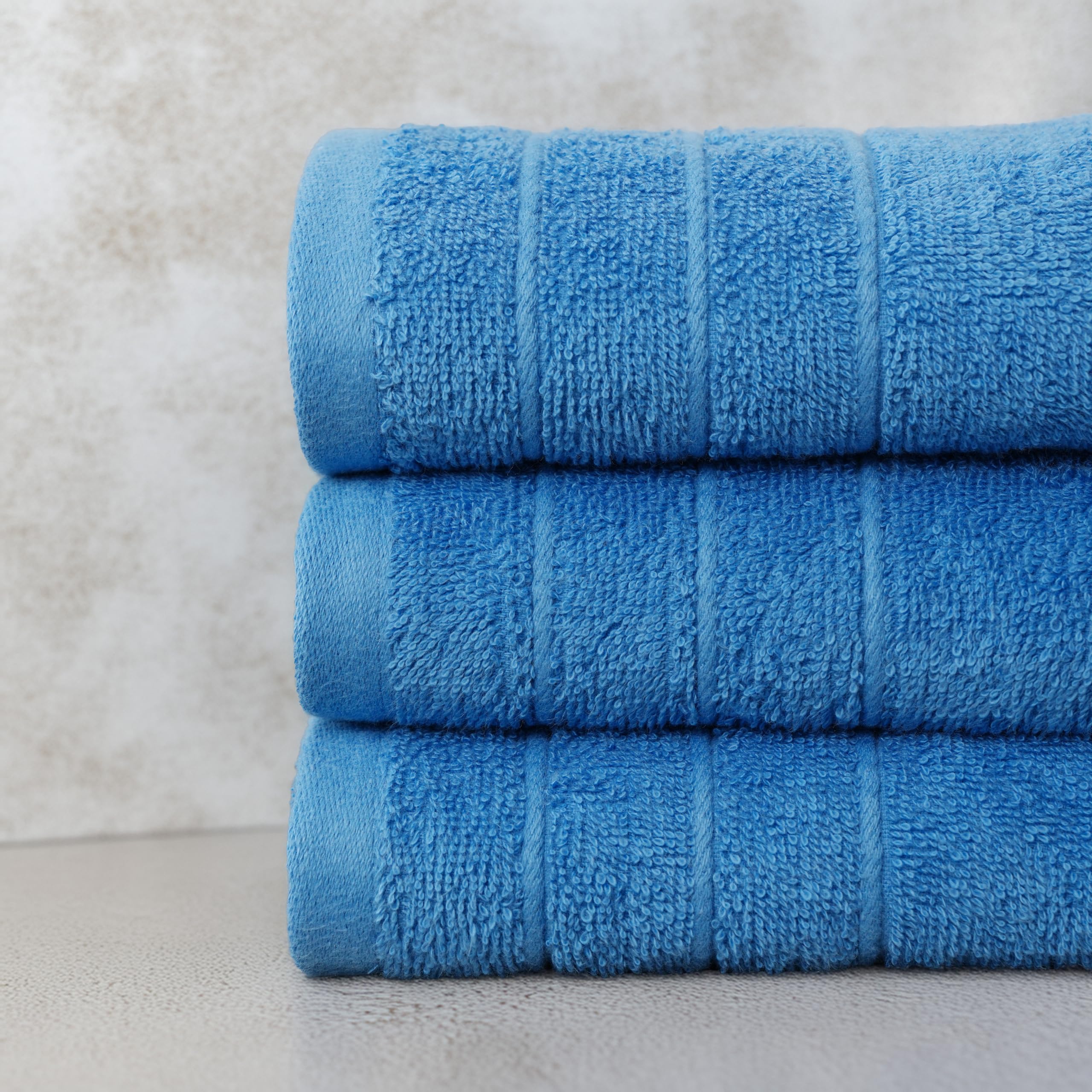 Tens Towels blue-quick-dry towels in use show moisture absorption.