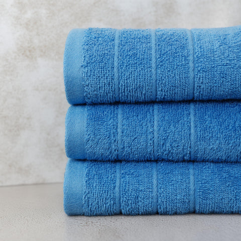 Tens Towels blue-quick-dry towels in use show moisture absorption.