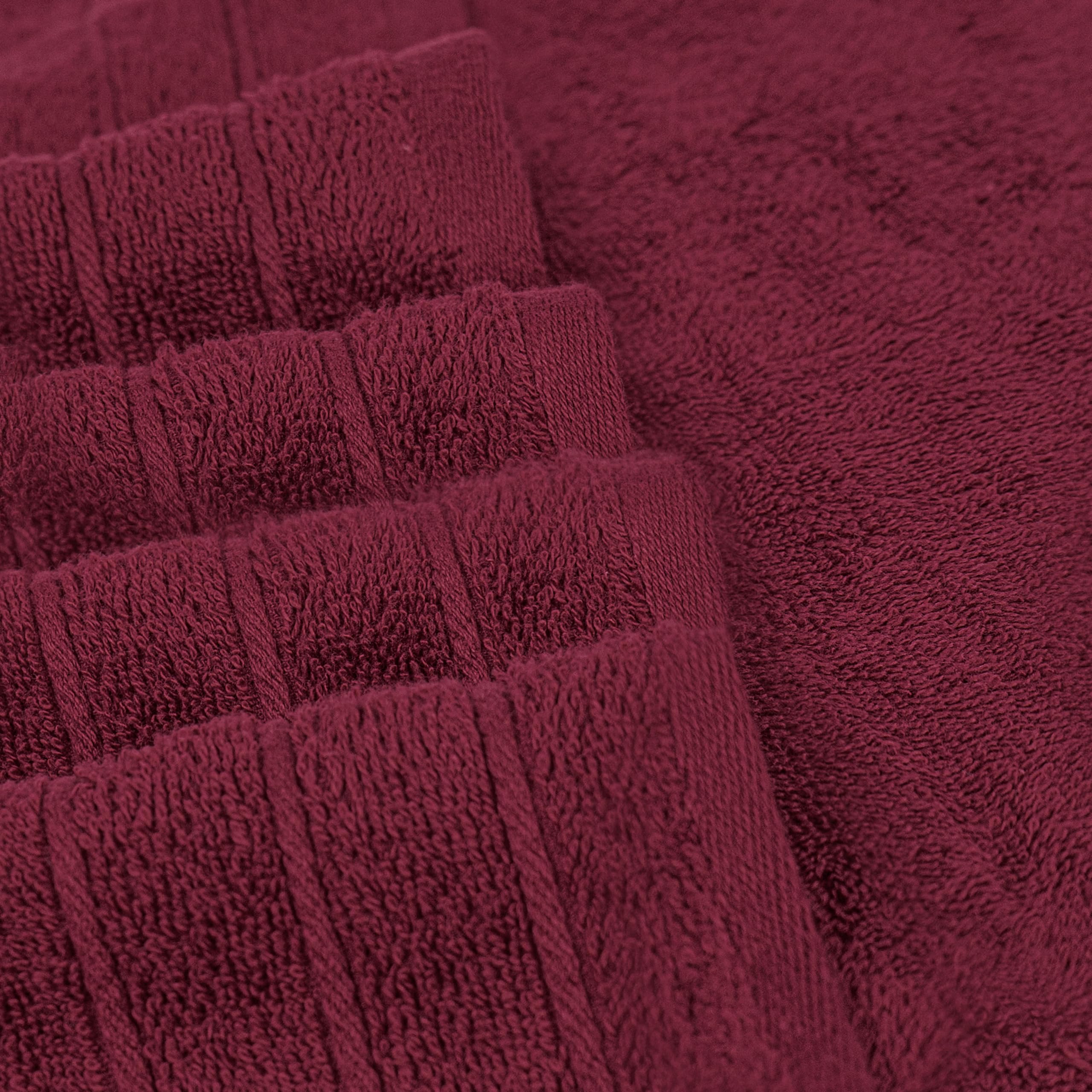 Tens Towels burgundy color finish enhances bathroom decor.
