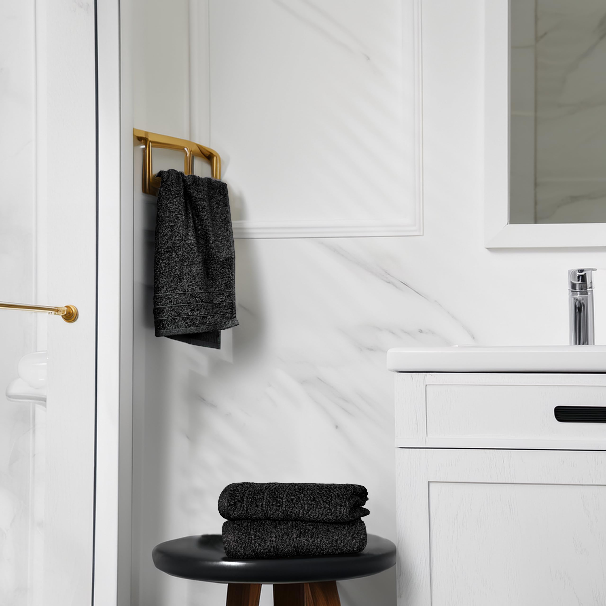 Tens Towels hand towels beside kitchen sink, absorbent for hands and spills.