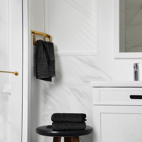 Tens Towels hand towels beside kitchen sink, absorbent for hands and spills.