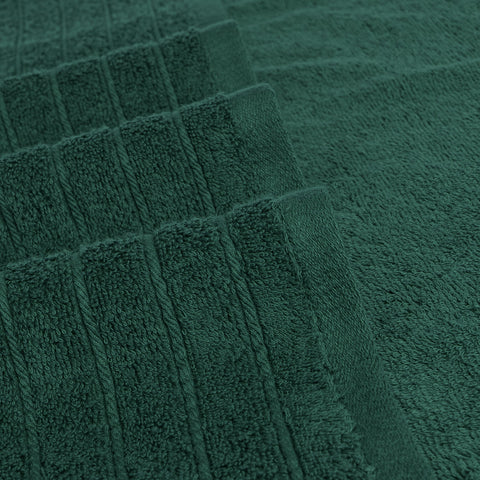Tens Towels hunter green color adds spa-like tone to bathroom.