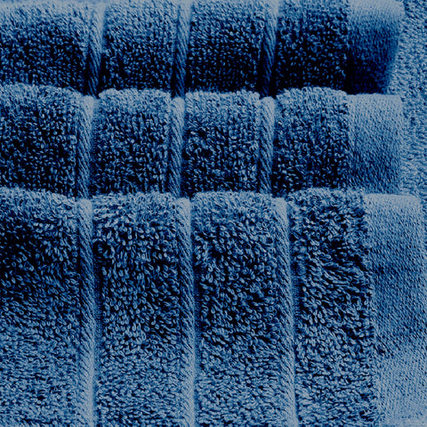 Tens Towels large 30x60 blue towel ready for wrapping after shower.