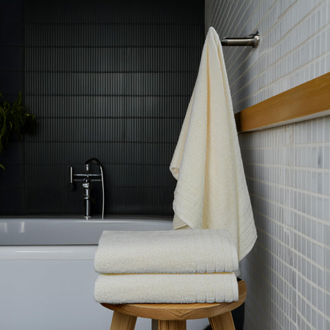 Tens Towels large wrap towel in a bathroom for full coverage.