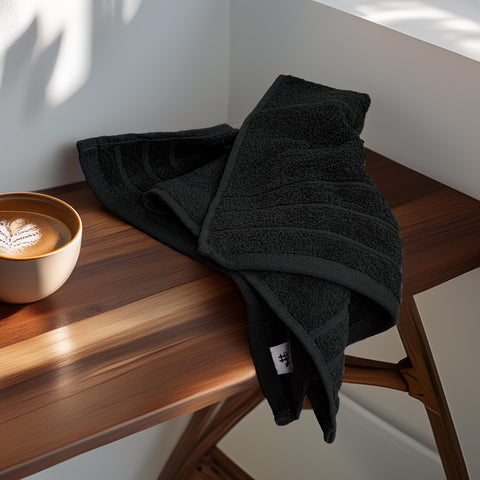 Tens Towels pack-6-hand-towels shown in laundry basket for easy care.