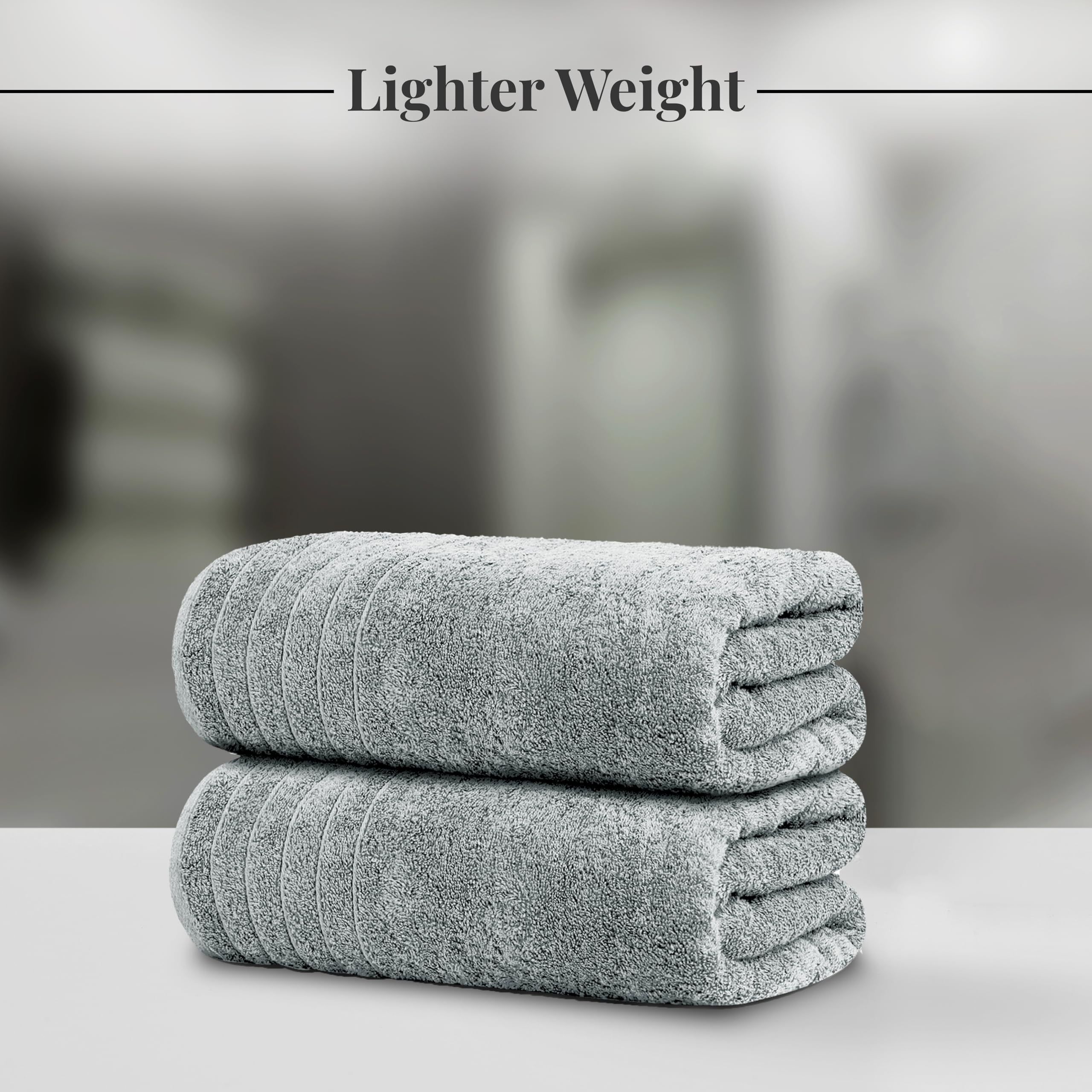 Soft 100% cotton Tens Towels bath sheet with plush texture and absorbency.