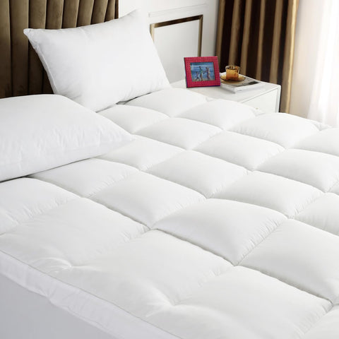 TESIONE Queen mattress topper close-up of spiral fiber filling for plush comfort.