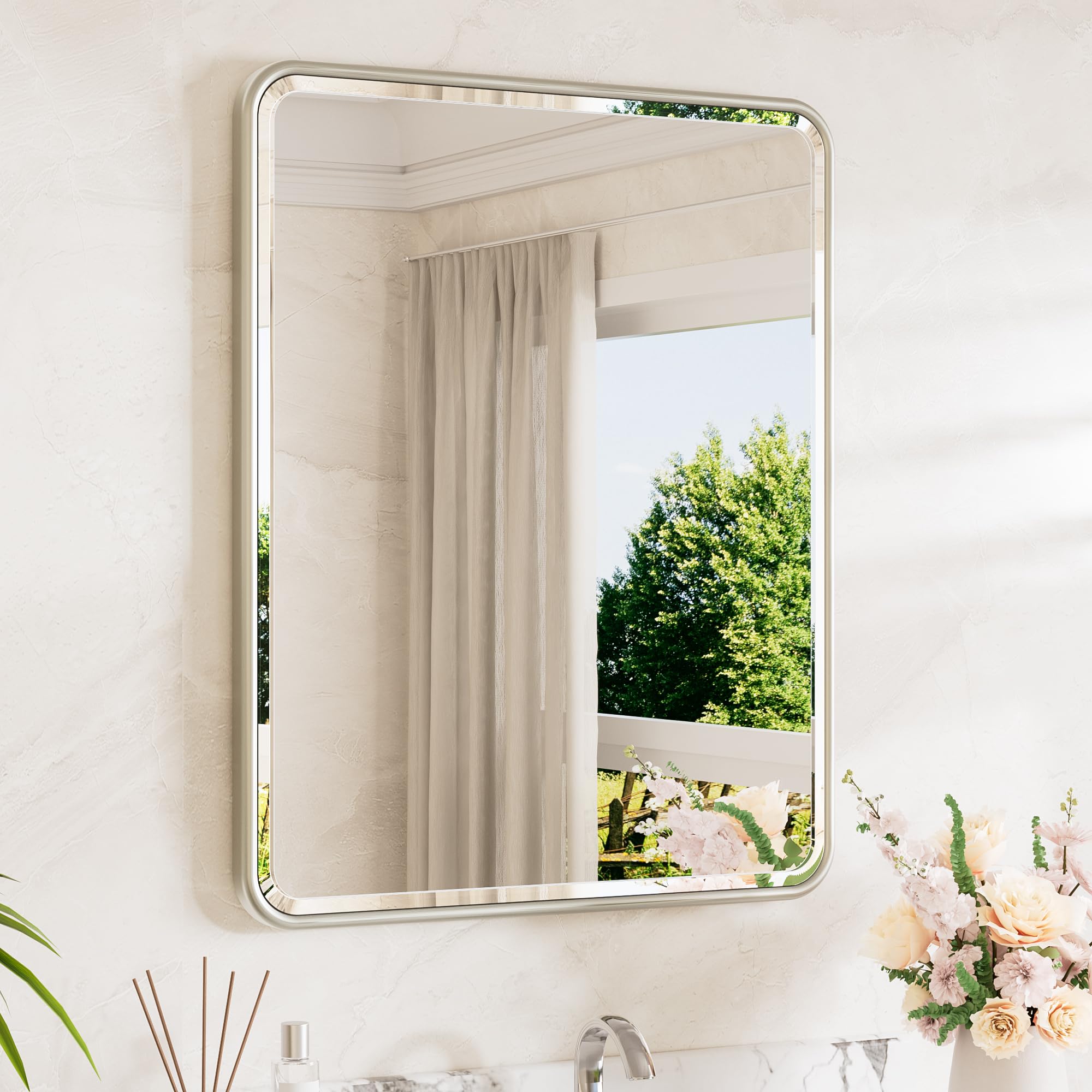 TETOTE brushed nickel mirror curved edge over sink for a modern bathroom look.