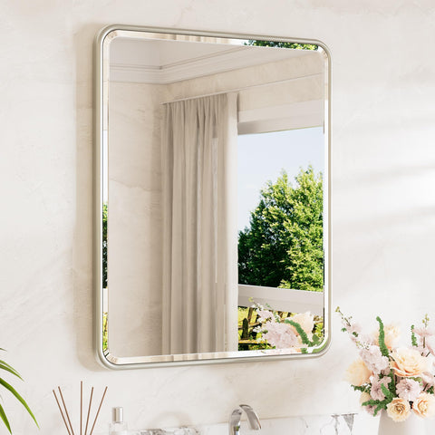 TETOTE brushed nickel mirror curved edge over sink for a modern bathroom look.