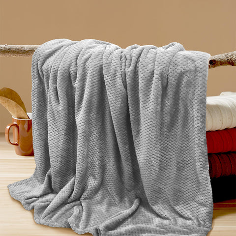 Tewloss gray throw adds comfort and decor to living spaces.