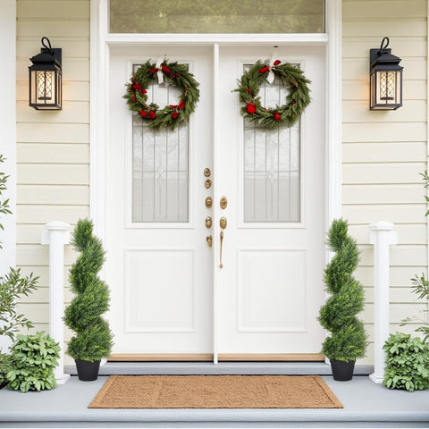 The Bloom Times two-pack artificial topiary trees with cedar-spiral design for welcoming entryways