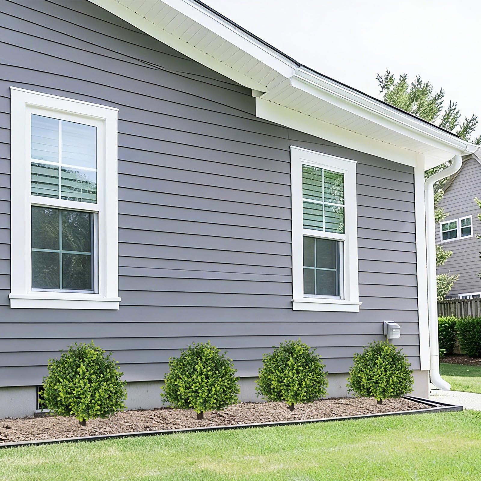 The Bloom Times topiary with ground spike, easy outdoor installation.