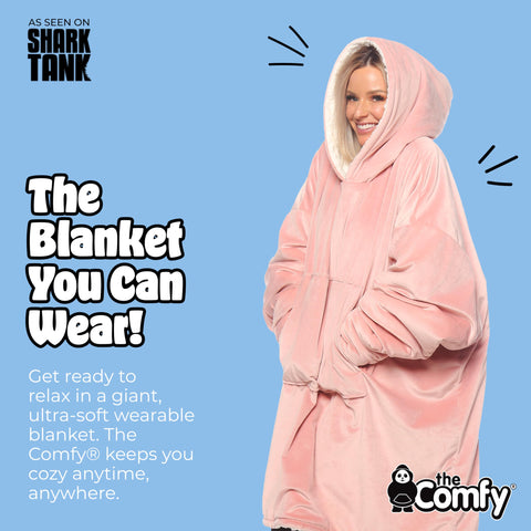 Model wearing The Comfy Original wearable blanket for lounge comfort