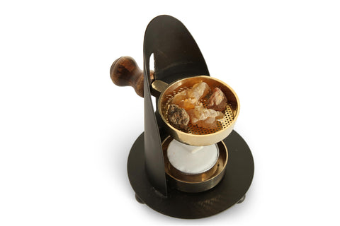 THE JERUSALEM GIFT SHOP compact burner doubles as altar decor.