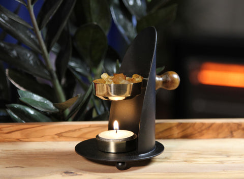 THE JERUSALEM GIFT SHOP brass resin burner showcases heat-safe charcoal use for resin incense.