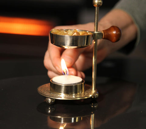 Fragrant frankincense incense granules close-up, ideal for peaceful prayer spaces.