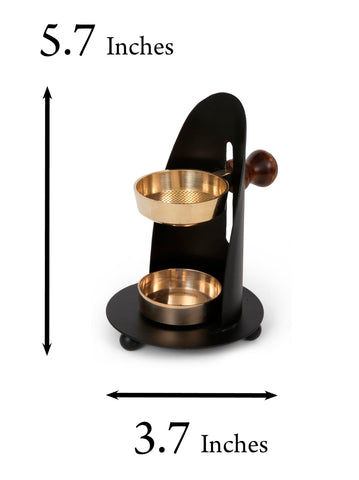 THE JERUSALEM GIFT SHOP incense burner rests on a wooden base, protecting surfaces.