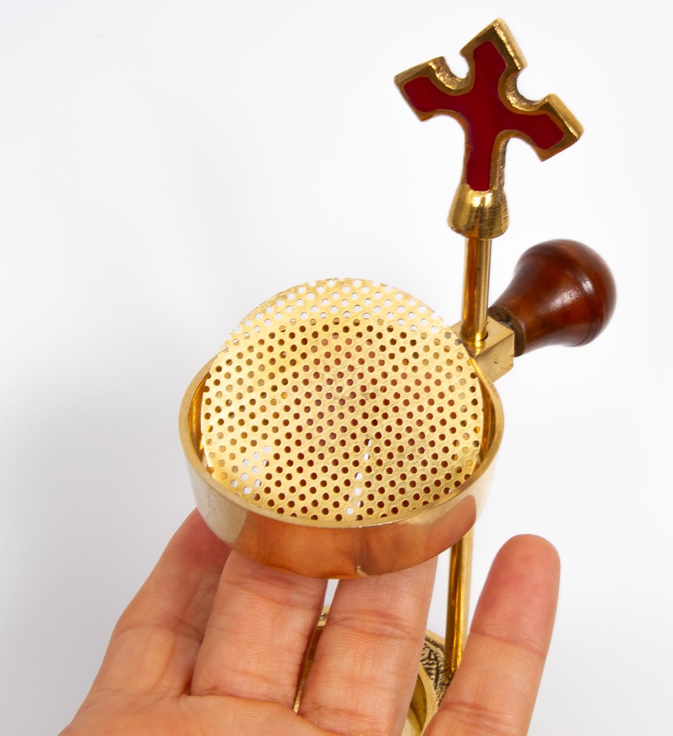 Stable heat-safe base reduces risk during worship and reflections.
