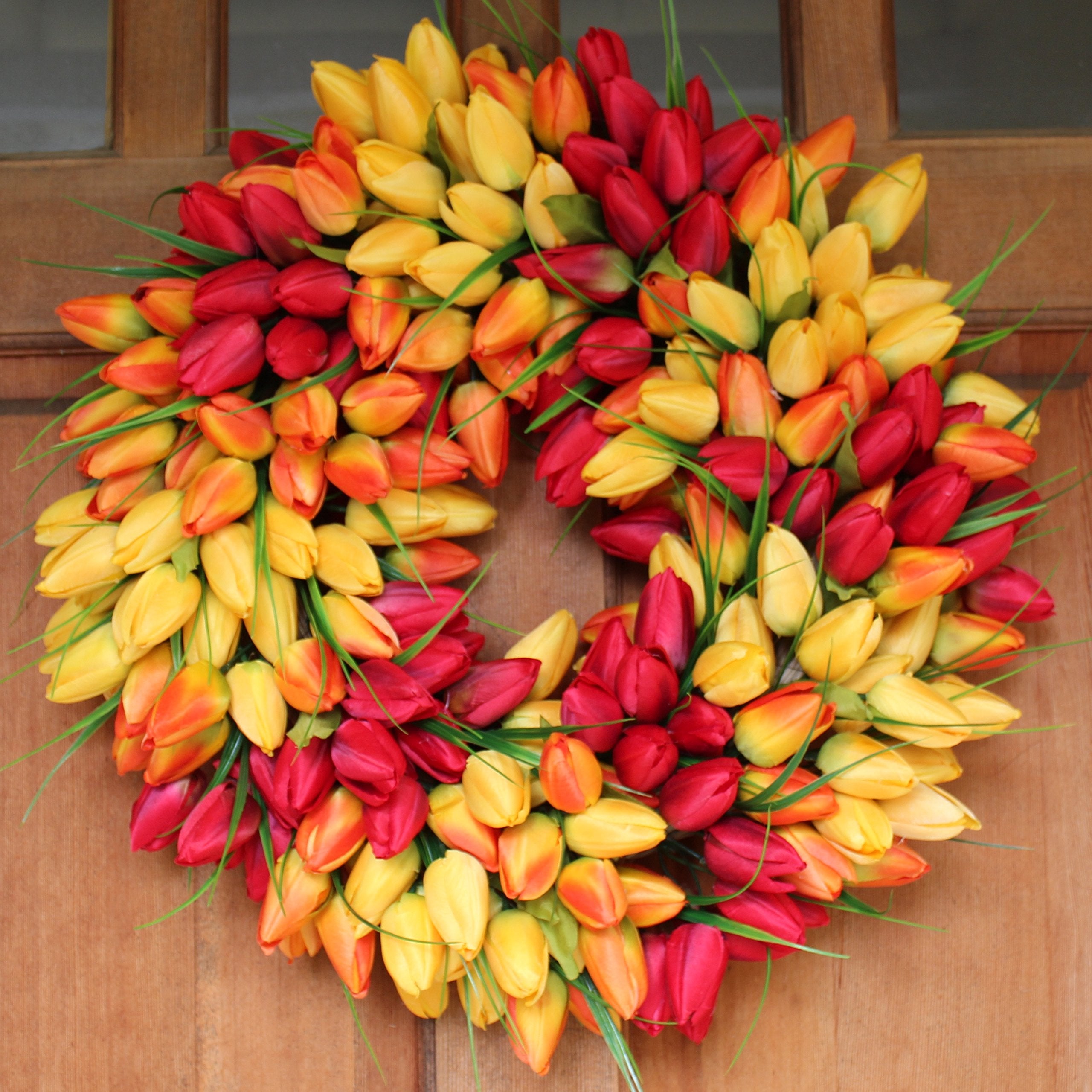 Close-up of silk tulip heads on The Wreath Depot wreath showing fullness.