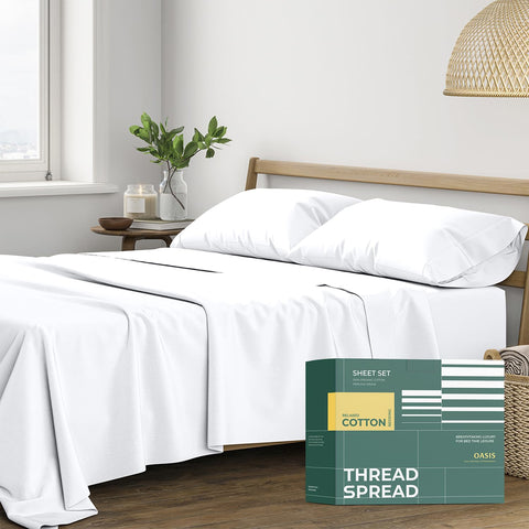 THREAD SPREAD percale sheets on bed show crisp, cooling comfort.
