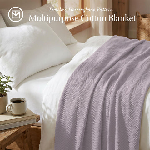 Threadmill 106x92-inch king-size blanket draped on bed for full-coverage comfort.