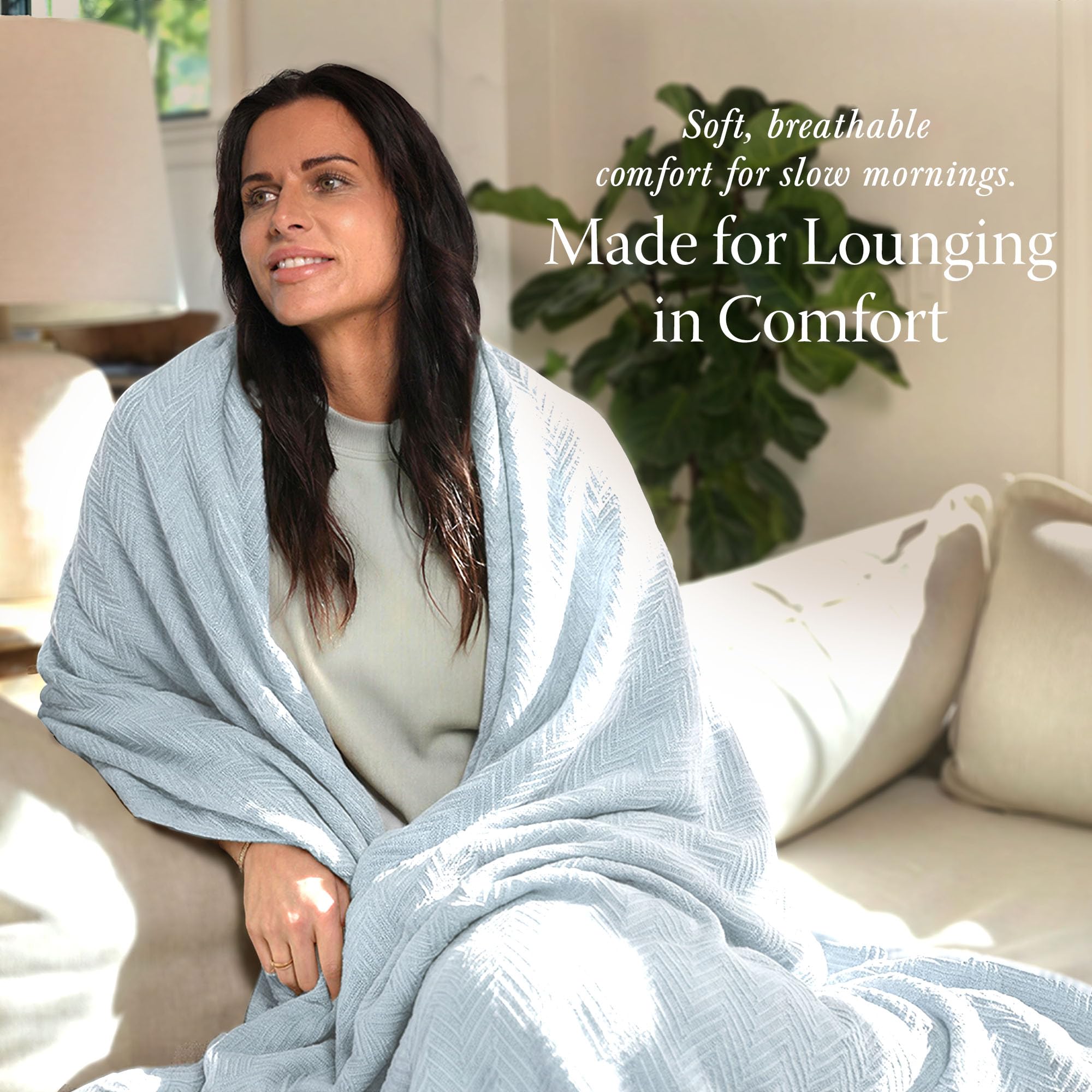 Threadmill all-season breathable blanket displayed on a sofa for cozy lounging