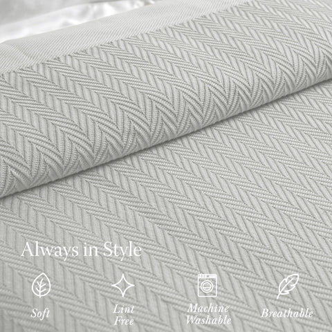 Threadmill luxury blanket folded beside a reading nook for relaxed evenings.