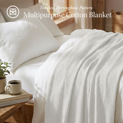 Threadmill herringbone cotton texture blanket prominently displays smooth, inviting warmth.