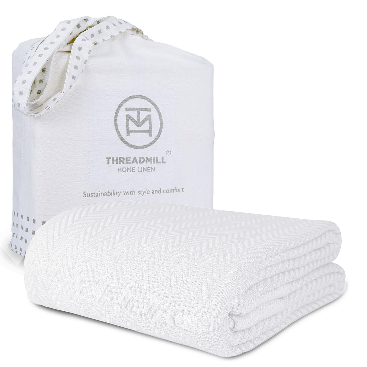 Threadmill luxury cotton blanket with herringbone weave on bed for cozy warmth
