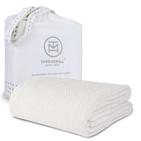 Threadmill luxury cotton blanket closeup highlights soft herringbone texture for king beds.