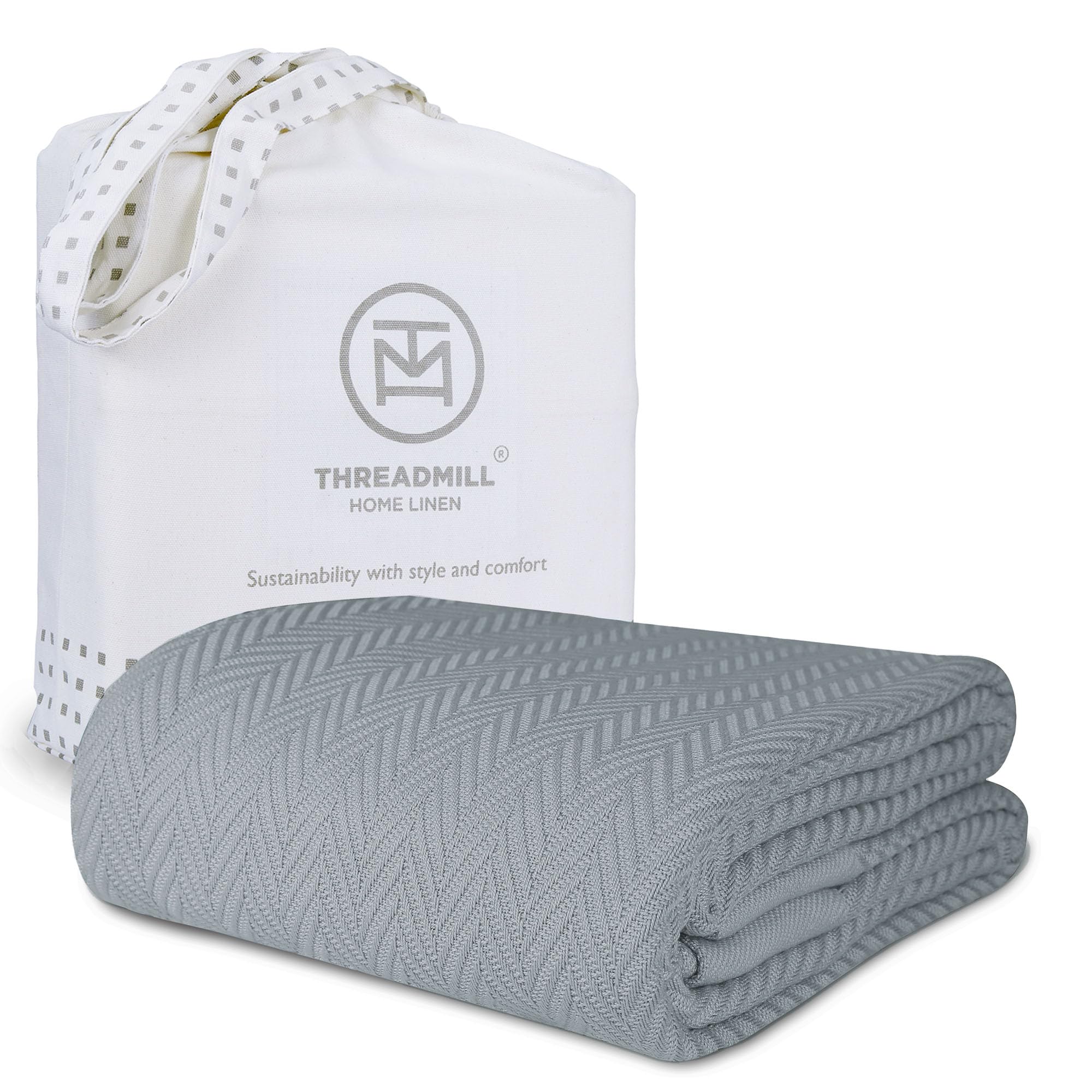 Threadmill luxury cotton blanket in Scottish Grey on a queen bed for all-season comfort.