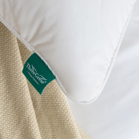 Three Geese pillow-care-label-closeup signals easy care and hygiene maintenance.