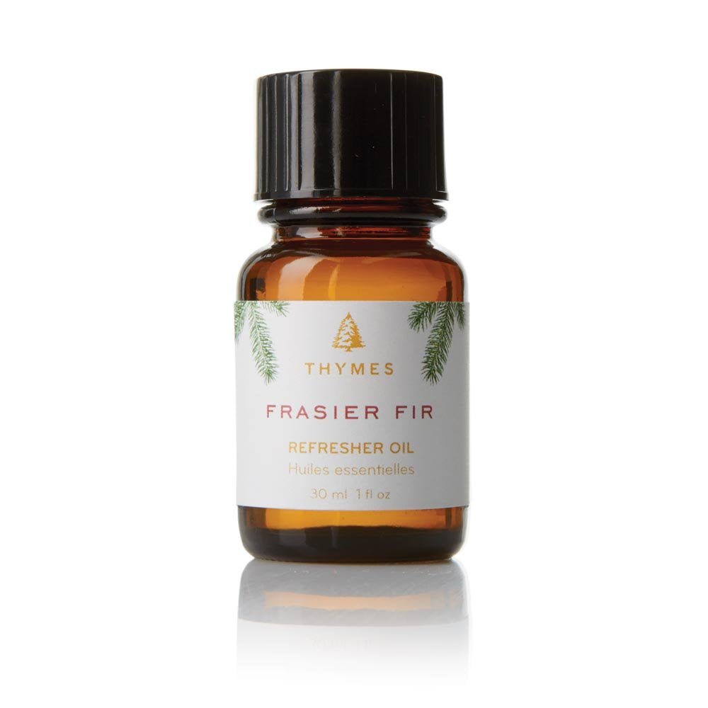 Thymes Frasier Fir Refresher Oil bottle delivering a crisp pine aroma for cozy spaces.