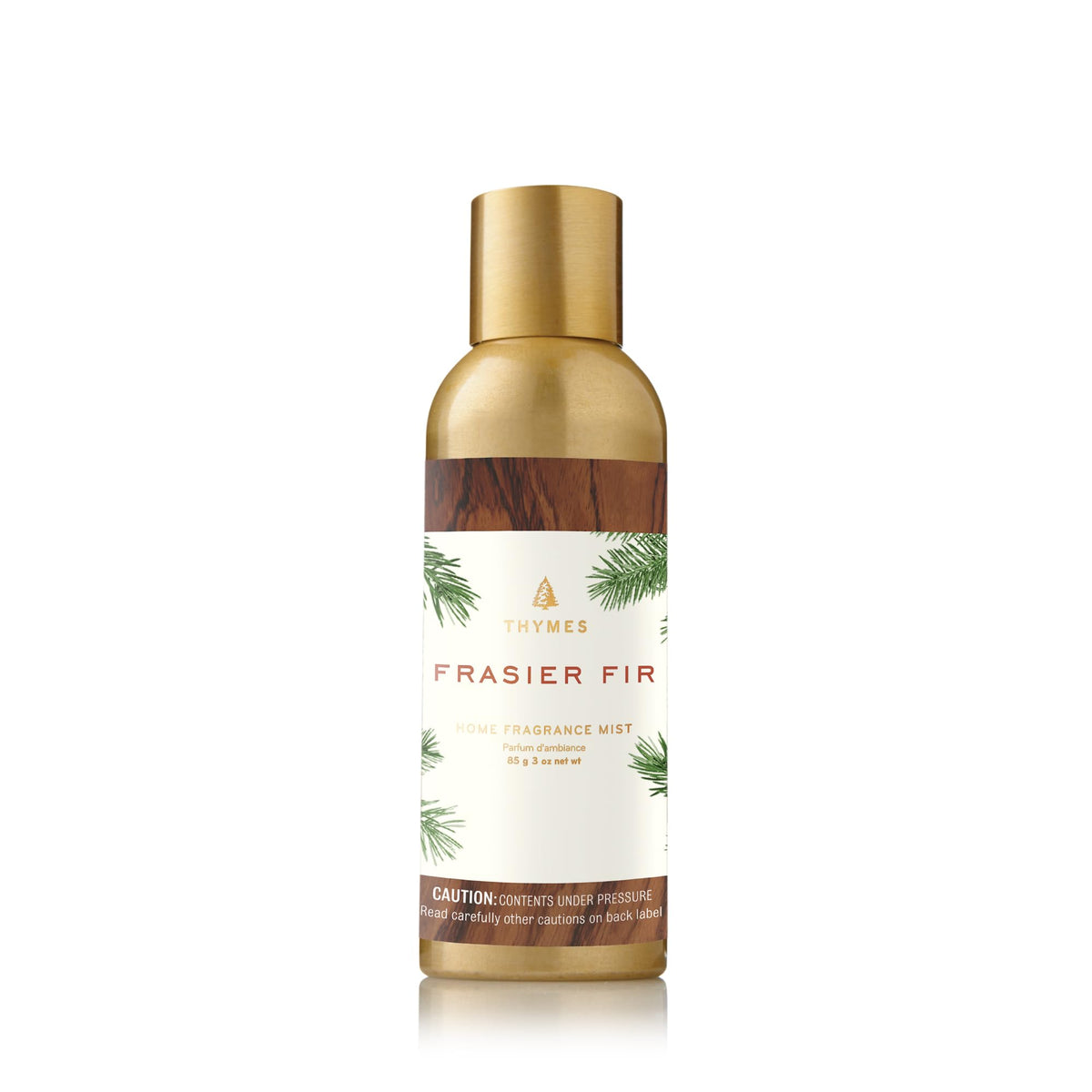 Thymes Frasier Fir mist bottle delivers piney freshness for a cozy winter vibe in your living room.
