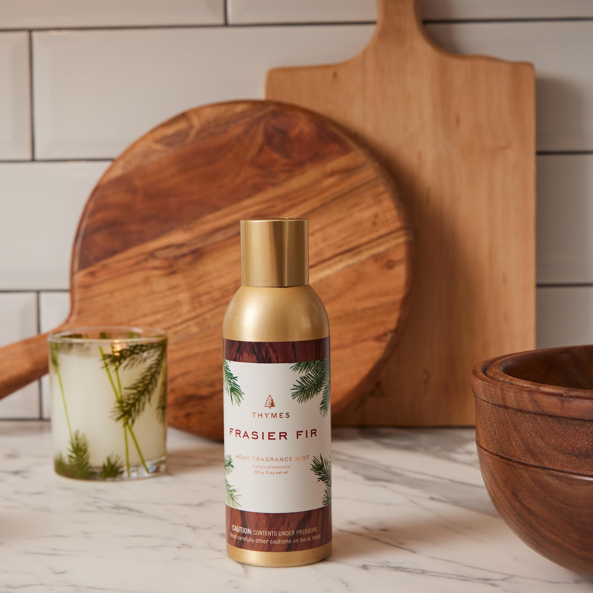 Thymes Frasier Fir sandalwood essence image emphasizes soft, comforting finish.