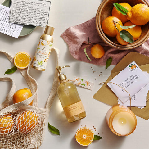 Thymes Mandarin Coriander mist closeup label signals premium, long-lasting aroma.