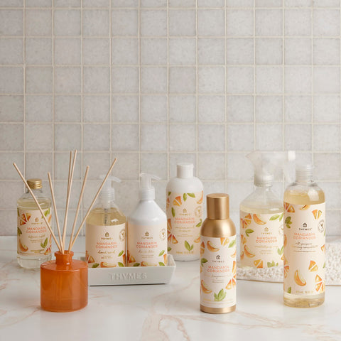 Thymes Mandarin Coriander mist dining room scene conveys citrus-herbal aroma.