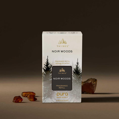 Thymes Pura Noir Woods refill angle view emphasizes smoky-wood aroma for sophisticated spaces.