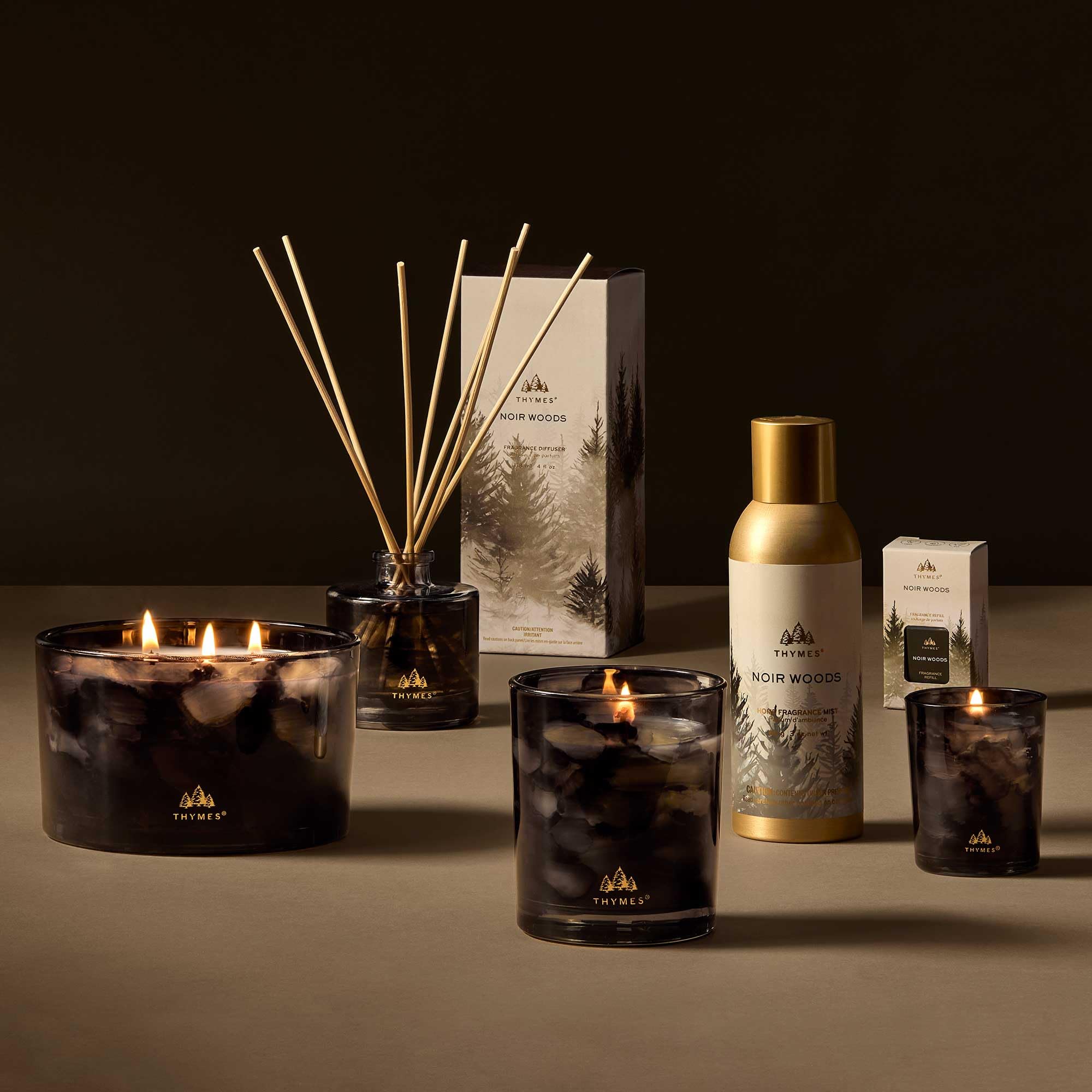 Thymes Pura Noir Woods refill modern-promo conveys luxury fragrance for contemporary homes.