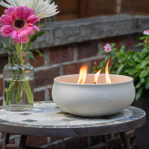 TIKI outdoor candle accents garden decor and defines cozy backyard gatherings.